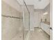 Elegant bathroom with double vanity, large shower, and granite countertop at 5401 Manchini St, Sarasota, FL 34238