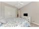 Bright bedroom with double doors and a TV at 5401 Manchini St, Sarasota, FL 34238