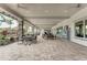 Covered patio with multiple tables and chairs at 5401 Manchini St, Sarasota, FL 34238