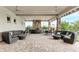 Large covered patio with comfortable seating and fireplace at 5401 Manchini St, Sarasota, FL 34238
