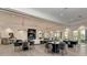 Large community gathering space with comfortable seating and large windows at 5401 Manchini St, Sarasota, FL 34238
