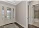 Bright entryway with hardwood floors, and a view into a bathroom at 5401 Manchini St, Sarasota, FL 34238
