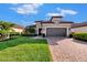 Single story home with a 2 car garage and nicely landscaped lawn at 5401 Manchini St, Sarasota, FL 34238
