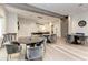 Game room with ping pong table, seating areas, and wood floors at 5401 Manchini St, Sarasota, FL 34238