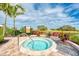 Community hot tub with surrounding landscaping at 5401 Manchini St, Sarasota, FL 34238