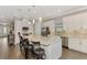 Modern kitchen with white cabinets, stainless steel appliances, and an island at 5401 Manchini St, Sarasota, FL 34238