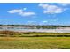 Peaceful lake view with calm waters and houses at 5401 Manchini St, Sarasota, FL 34238