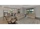 Relaxing living room with water views and access to the kitchen at 5401 Manchini St, Sarasota, FL 34238