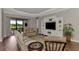 Comfortable living room with a built in entertainment center at 5401 Manchini St, Sarasota, FL 34238