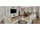 Open concept living area with adjacent dining and kitchen areas at 5401 Manchini St, Sarasota, FL 34238