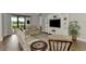 Spacious living room with comfortable seating and a large TV at 5401 Manchini St, Sarasota, FL 34238