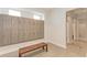 Clean and spacious locker room with showers and wooden bench at 5401 Manchini St, Sarasota, FL 34238
