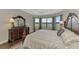 Luxurious Primary bedroom, featuring a large bed and water view at 5401 Manchini St, Sarasota, FL 34238