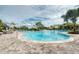 Resort-style pool with lounge chairs and landscaping at 5401 Manchini St, Sarasota, FL 34238