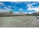 Full-size tennis court with green surface at 5401 Manchini St, Sarasota, FL 34238