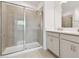 Bathroom with shower, double vanity, and tile flooring at 5447 Tripoli Dr, Palmetto, FL 34221