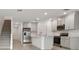 Modern kitchen with gray cabinets, stainless steel appliances, and island at 5447 Tripoli Dr, Palmetto, FL 34221