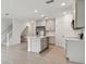 Modern kitchen with gray cabinets, island, and stainless steel appliances at 5447 Tripoli Dr, Palmetto, FL 34221