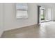 Bright living room with tile floors and sliding glass doors to patio at 5447 Tripoli Dr, Palmetto, FL 34221