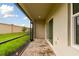 Screened-in patio with brick pavers and grassy backyard view at 5447 Tripoli Dr, Palmetto, FL 34221