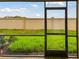 Private screened patio overlooking a grassy backyard at 5447 Tripoli Dr, Palmetto, FL 34221