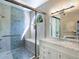 Bathroom with walk-in shower, blue tile, and built-in bench at 5544 Dinah Ln, Sarasota, FL 34231