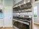 Stainless steel double ovens and range hood, built-in shelving for spices at 5544 Dinah Ln, Sarasota, FL 34231