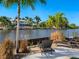 Peaceful waterfront view with lounge chairs at 5544 Dinah Ln, Sarasota, FL 34231