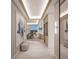 Bright and spacious entryway with modern design, showcasing a view to the dining area and wet bar at 555 Quay Cmn # 1105, Sarasota, FL 34236