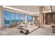 Open concept living room with water views and white sofa at 555 Quay Cmn # Ph2002, Sarasota, FL 34236