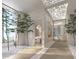 Spa-like hallway with plants and natural light at 555 Quay Cmn # Ph2002, Sarasota, FL 34236