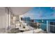 Spacious balcony with outdoor seating and city views at 555 Quay Commons # 402, Sarasota, FL 34236