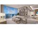 Elegant dining room with marble table and wine storage at 555 Quay Commons # 402, Sarasota, FL 34236