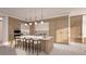 Modern kitchen with island and stainless steel appliances at 555 Quay Commons # 402, Sarasota, FL 34236