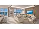 Spacious living room with fireplace and water views at 555 Quay Commons # 402, Sarasota, FL 34236
