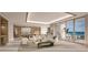 Open floor plan with kitchen, living area, and balcony access at 555 Quay Commons # 402, Sarasota, FL 34236