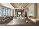 Elegant lobby with comfortable seating and fireplace at 555 Quay Commons # 402, Sarasota, FL 34236