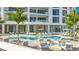 Resort-style pool with lounge chairs and fire pit at 555 Quay Commons # 402, Sarasota, FL 34236