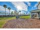 Spacious backyard with playground and wood chips at 5755 Woodland Sage Dr, Sarasota, FL 34238