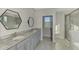 Double vanity bathroom with granite countertop and shower at 5755 Woodland Sage Dr, Sarasota, FL 34238