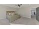 Main bedroom with king bed and access to another room at 5755 Woodland Sage Dr, Sarasota, FL 34238