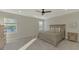 Large bedroom with a king-size bed and wood dresser at 5755 Woodland Sage Dr, Sarasota, FL 34238