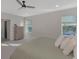 Main bedroom with king-size bed and ensuite bathroom at 5755 Woodland Sage Dr, Sarasota, FL 34238
