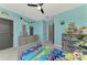 bedroom with twin bed, dresser, and bookshelf at 5755 Woodland Sage Dr, Sarasota, FL 34238