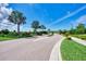Landscaped entrance to the community at 5755 Woodland Sage Dr, Sarasota, FL 34238