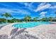 Inviting community pool with surrounding lounge chairs at 5755 Woodland Sage Dr, Sarasota, FL 34238