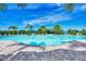 Resort-style pool with lounge chairs and palm trees at 5755 Woodland Sage Dr, Sarasota, FL 34238