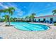 Large community pool with plenty of lounge chairs at 5755 Woodland Sage Dr, Sarasota, FL 34238