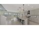 Modern kitchen with gray cabinets, granite island, and stainless steel appliances at 5755 Woodland Sage Dr, Sarasota, FL 34238