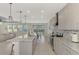 Bright kitchen with an island, stainless steel appliances, and backyard view at 5755 Woodland Sage Dr, Sarasota, FL 34238